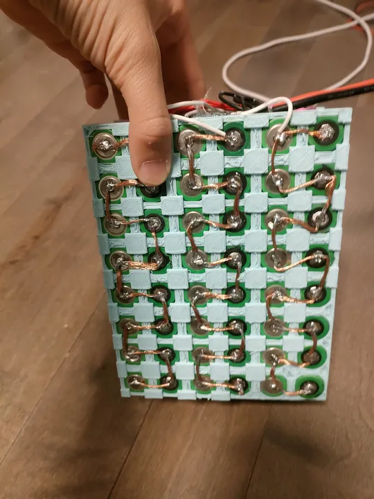 Hand-soldered battery bus