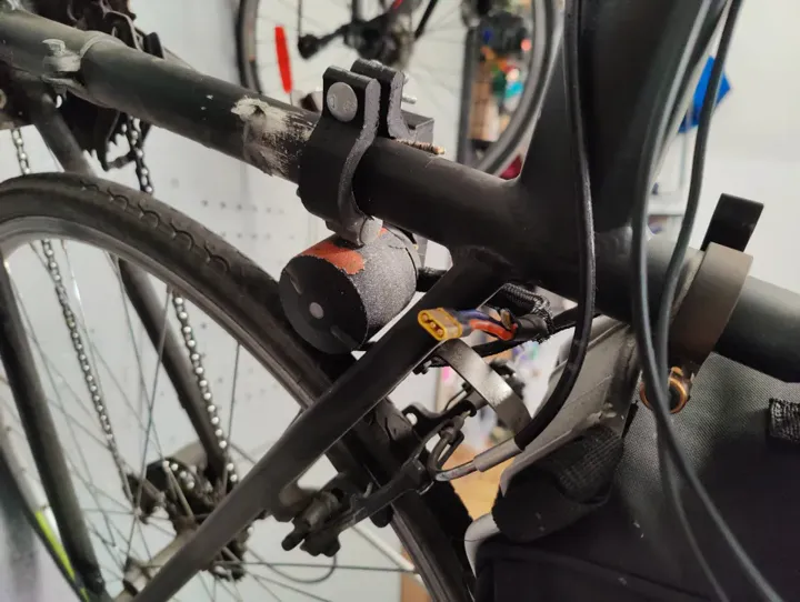 Leafboard motor mounted on the spray-painted black bike frame