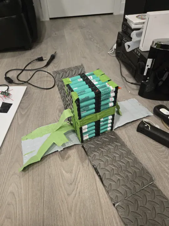 Battery pack interior with foam and duct tape