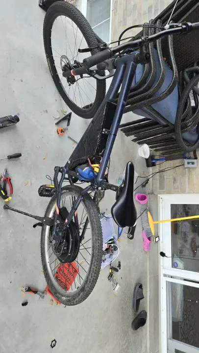 Finished ebike with a bag holding the VESC controller