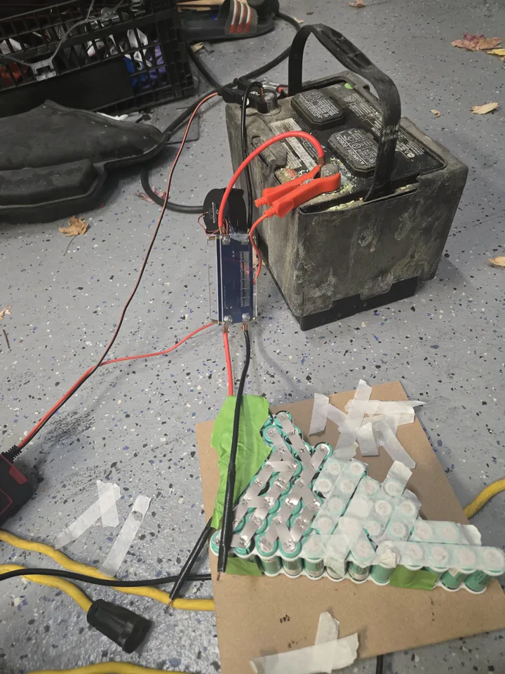 Spot welding the nickel strips onto the cell array