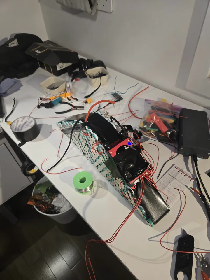BMS wiring in progress — balance leads being soldered